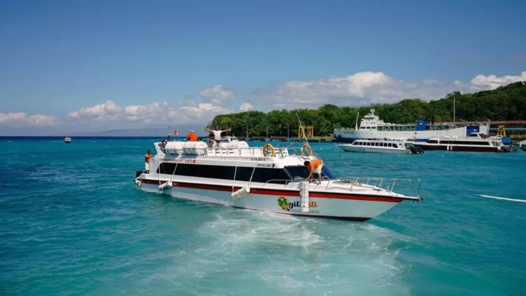 Gili Gili Fast Boat (small vessel) at serene Padang Bai waters, agile fast boat for direct Bali to Gili Islands transfers.