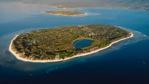 Sunset aerial panorama of Gili Meno's compact size and beauty, the serene view rewarding your journey from Sanur to Gili Meno.