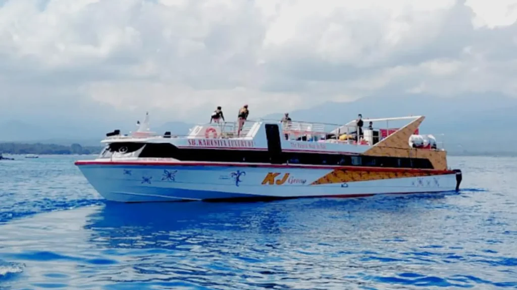 Karuniya Luxury Fast Boat anchored on calm waters, premium exterior design for exclusive Bali to Gili Islands travel.