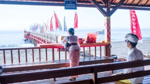 Couple waiting for departure at Kusamba Fast Boat Harbor, Klungkung, local port for fast boat transfers to Nusa Penida.
