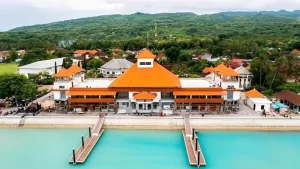 Majestic front view of Sampalan fast boat harbor's modern terminal building in Nusa Penida, impressive architectural gateway to the island.