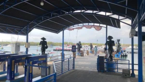 Passenger walkway and access gate to the arrival at Serangan Harbor, boarding point for fast boats to Nusa Penida and the Gili Islands.