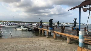 Dock and mooring area at Serangan Harbor, where fast boats load and unload passengers for Bali island transfers.