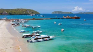 Fast boats anchored near the shore at Toyapakeh Harbor Nusa Penida, main maritime gateway to the island.
